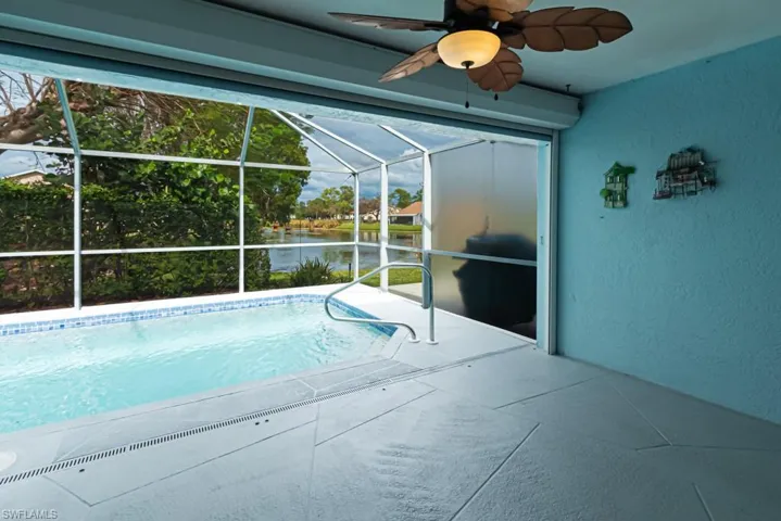 View of yard featuring glass enclosure
