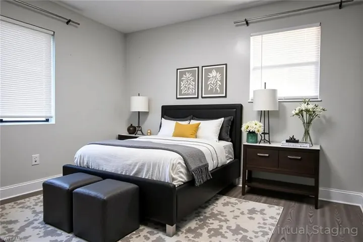 Bedroom with baseboards and dark wood finished floors