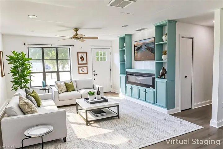 Living room featuring recessed lighting, wood finished floors, and a ceiling fan