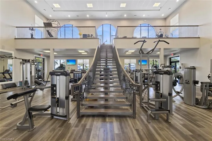 Workout area featuring a towering ceiling