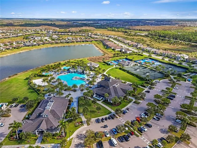 View of property location featuring a large body of water and nearby suburban area