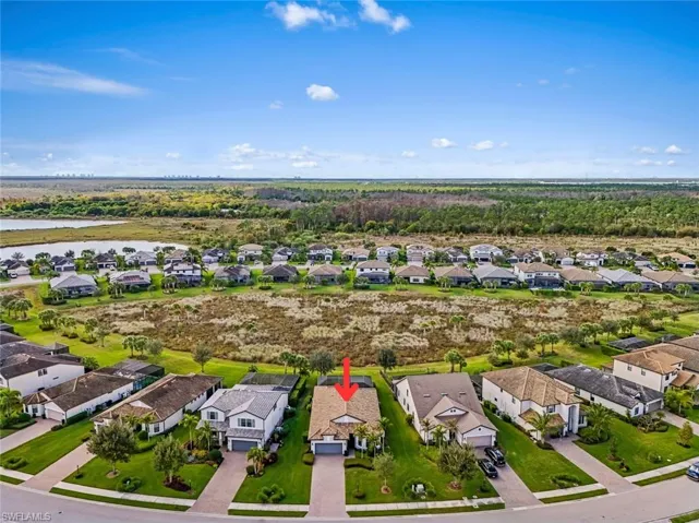 Aerial perspective of suburban area with a large body of water