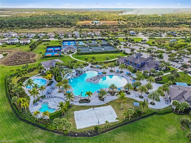 Aerial view of residential area featuring a pool