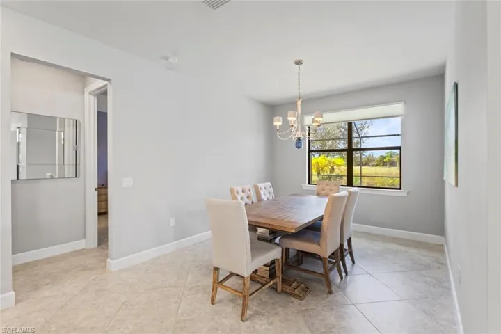 Dining space featuring a chandelier and light tile patterned floors