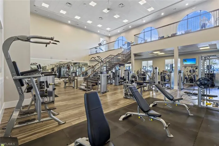 Exercise room featuring a high ceiling