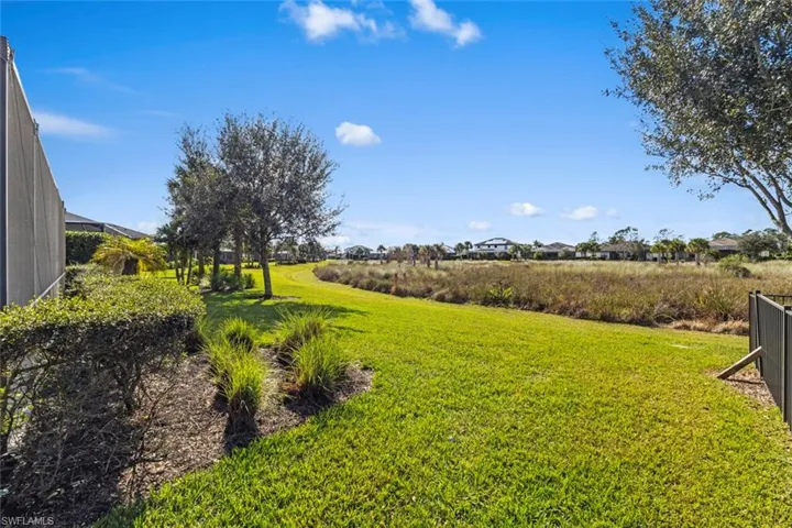 View of green lawn with glass enclosure