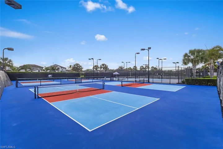 View of tennis court with community basketball court