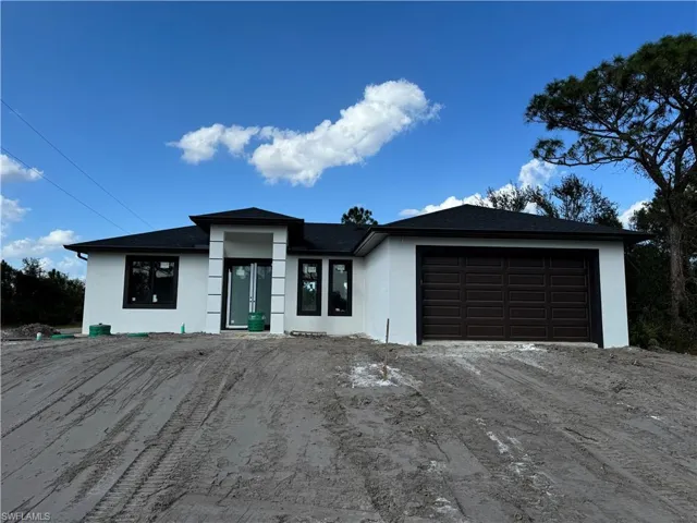 View of front of home with a garage