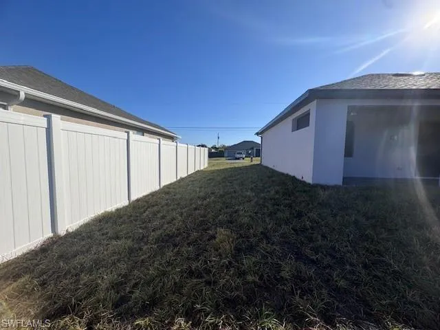 View of side of home with yard