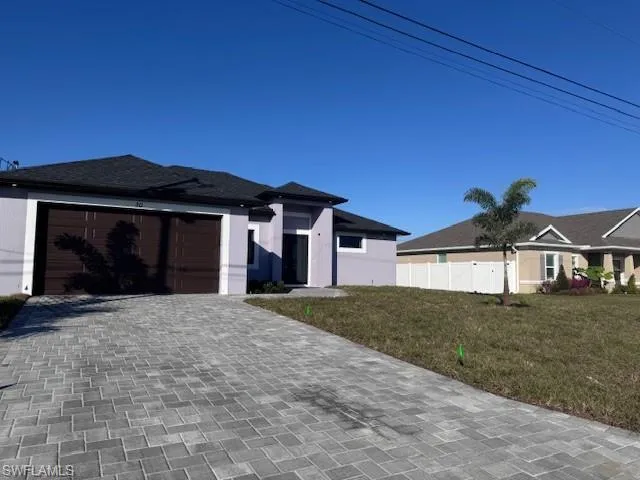 View of front of property with a front yard