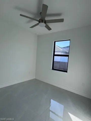 Spare room featuring ceiling fan