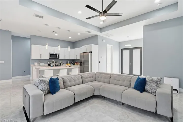Living area featuring recessed lighting and ceiling fan