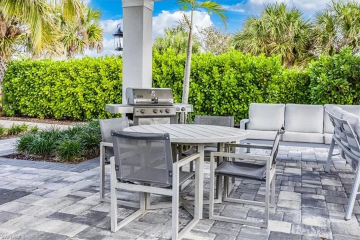 View of patio with a grill and outdoor lounge area