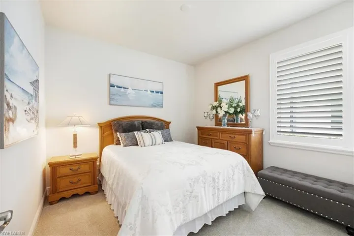 Bedroom with light carpet