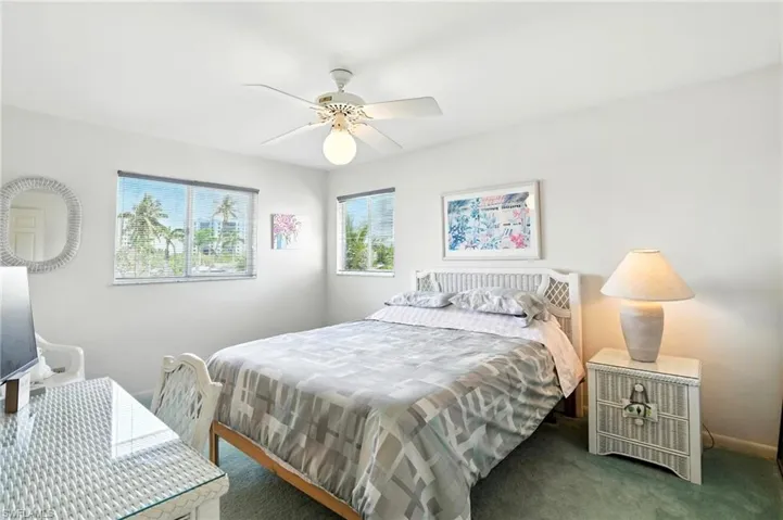 Carpeted bedroom 3 featuring baseboards and ceiling fan - Virtually Edited Image. 2nd floor
