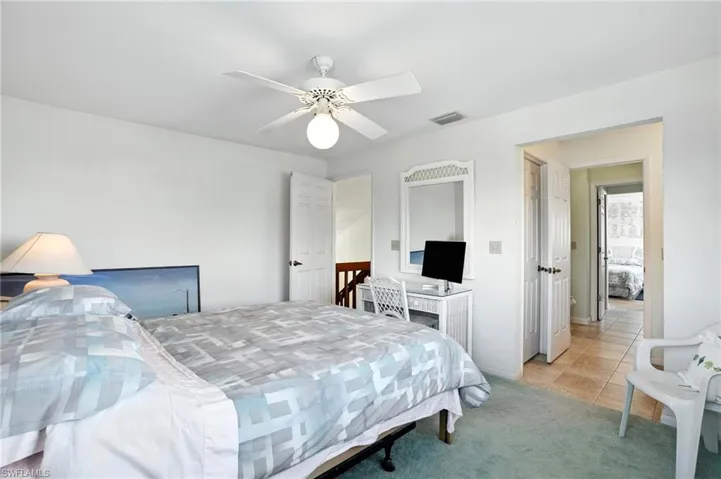 Bedroom 3 featuring light colored carpet, light tile patterned flooring, and a ceiling fan - Virtually Edited Image. 2nd floor