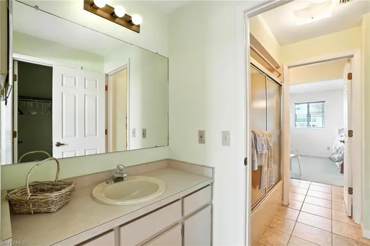 Bathroom featuring vanity and tile patterned floors - Virtually Edited Image