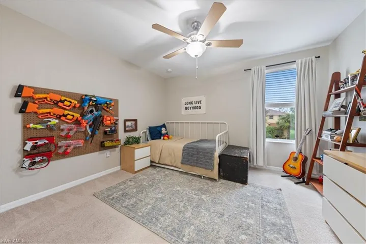 Bedroom featuring carpet floors and ceiling fan