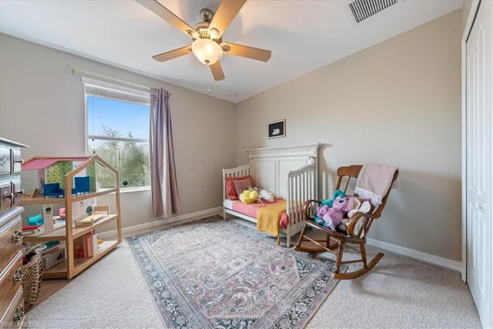 Bedroom with carpet flooring and ceiling fan