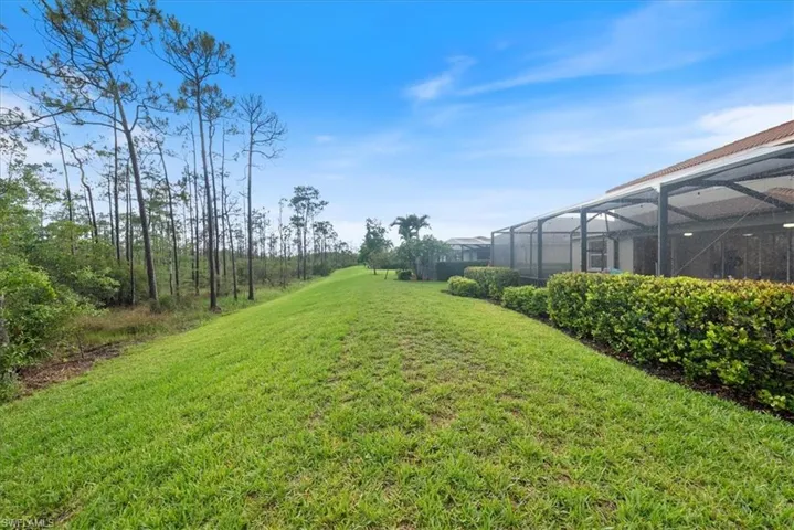 View of green lawn with a lanai