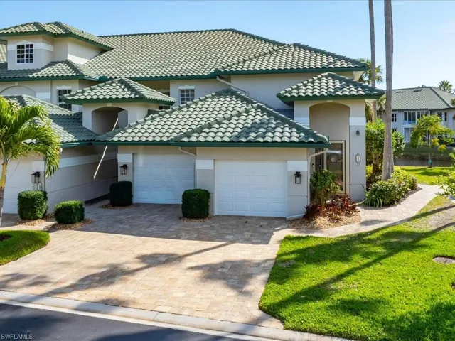 Mediterranean / spanish home with stucco siding, decorative driveway, an attached garage, and a tile roof