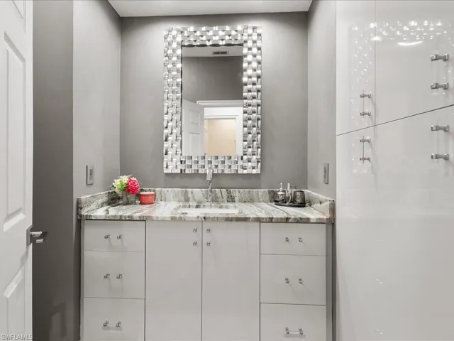 Powder Bathroom with quartzite counter and European cabinets