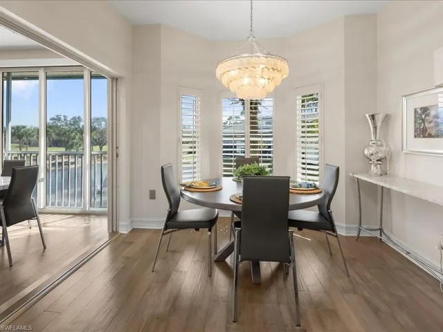 Dining/Breakfast area featuring striking chandelier and wood flooring