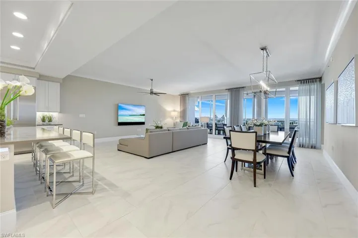 Sweeping open-concept layout showcasing the perfect harmony between kitchen, dining, and great room with stunning natural light throughout.