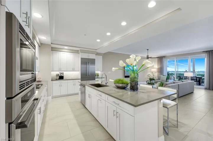 Gorgeous oversized island with bar seating and a seamless sightline straight into the living space — perfect for entertaining in style!
