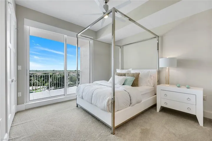Bright guest bedroom with lanai access and ensuite bathroom.