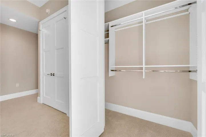 Additional guest closet with generous hanging space and clean built-in storage for a neat, organized feel.