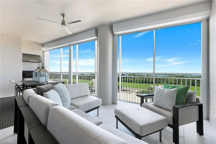 Expansive screened lanai with comfortable lounge seating and stunning wide-open views — the perfect place to relax and soak in the Florida breeze!