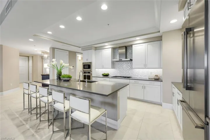 Beautiful and highly functional.  you will love this chef’s kitchen with oversized island seating, sleek cabinetry, and endless counter space for cooking, gathering, and casual dining.