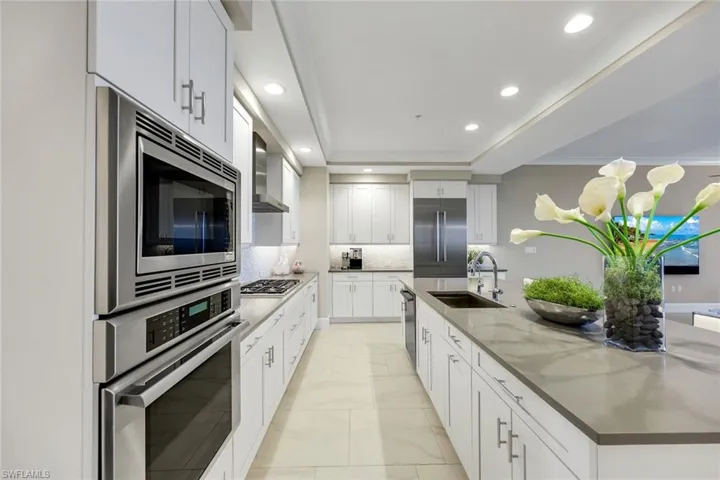 Stainless appliances, gas cooktop, and clean modern finishes — this kitchen truly has it ALL!