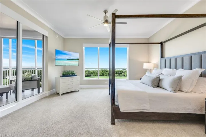 Primary suite with private lanai access, bright open views, and the perfect blend of comfort and luxury for everyday retreat-style living!