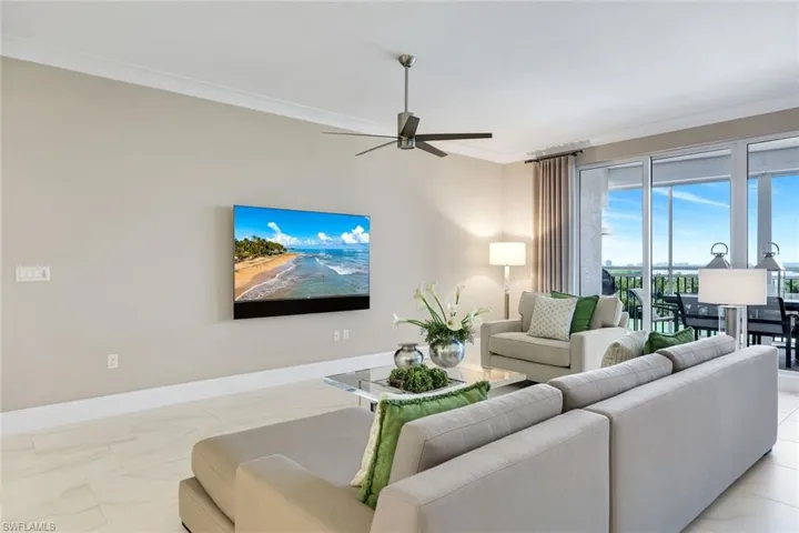Bright and airy living space with designer finishes, cozy seating, and seamless access to the lanai for true indoor-outdoor living.