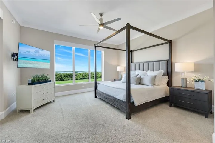 Spacious and serene primary suite with natural light, plush carpeting, and calming views to unwind at the end of the day!