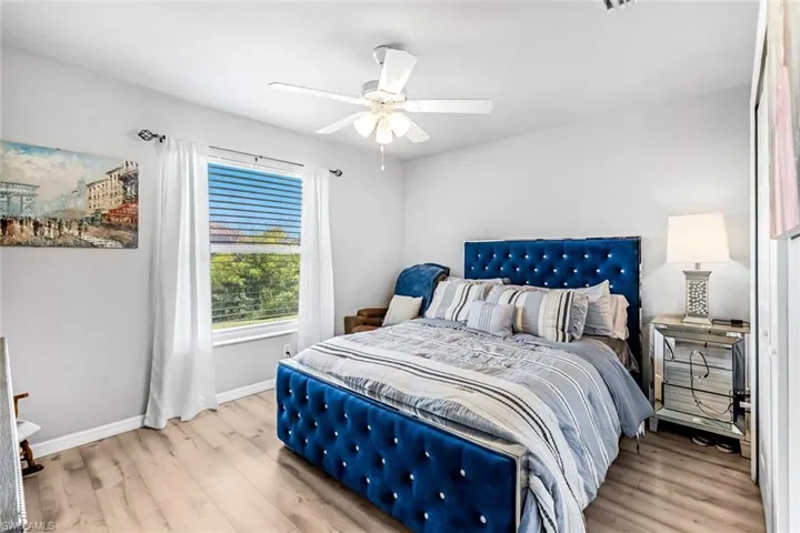 Bedroom featuring light wood-type flooring and ceiling fan