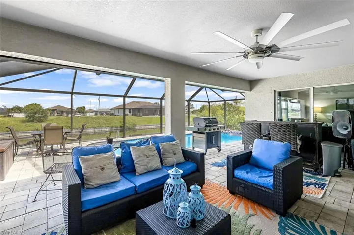 Sunroom / solarium featuring ceiling fan