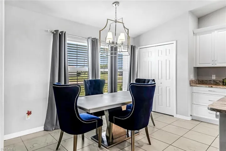 Dining room with a chandelier and vaulted ceiling