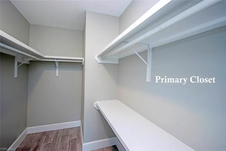 View of walk in closet with shelving
