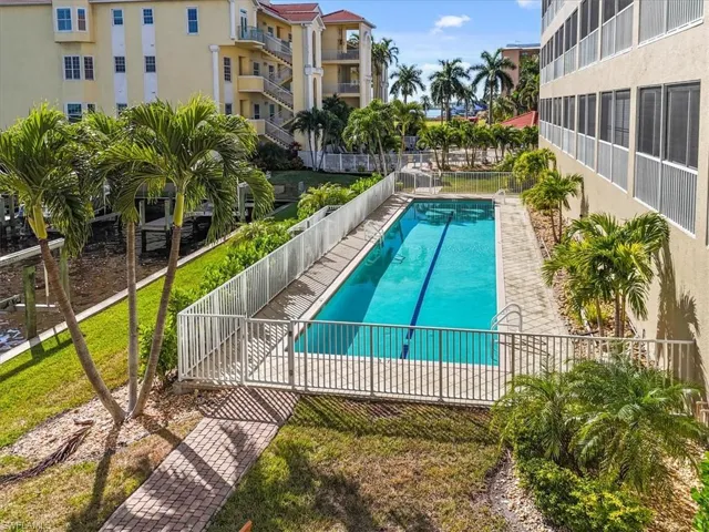Community pool featuring a patio