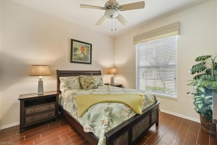 Bedroom with wood finish floors and a ceiling fan
