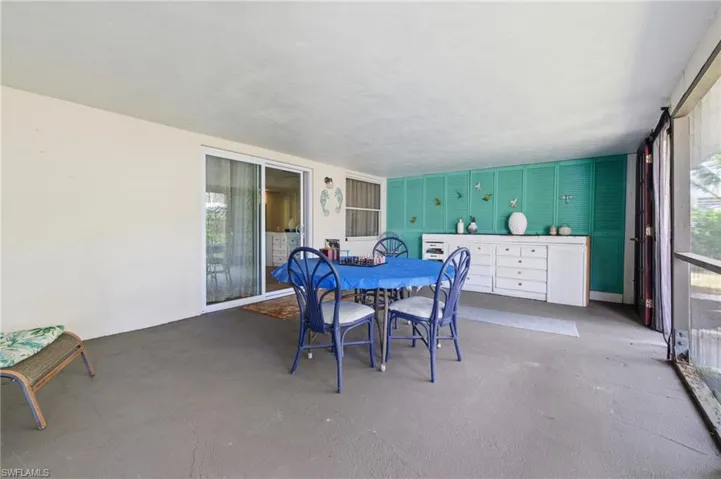 Large Screened Room with outdoor dining area and built-in cabinet