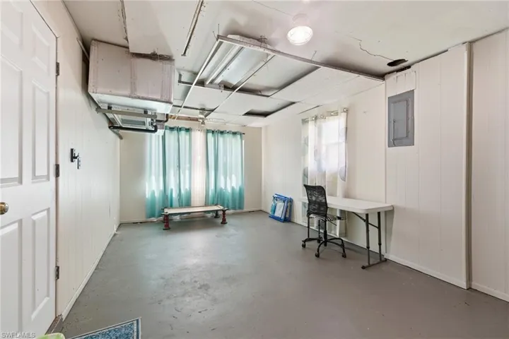 Utility room with air handler, washer/dryer, hot water tank and electric panel