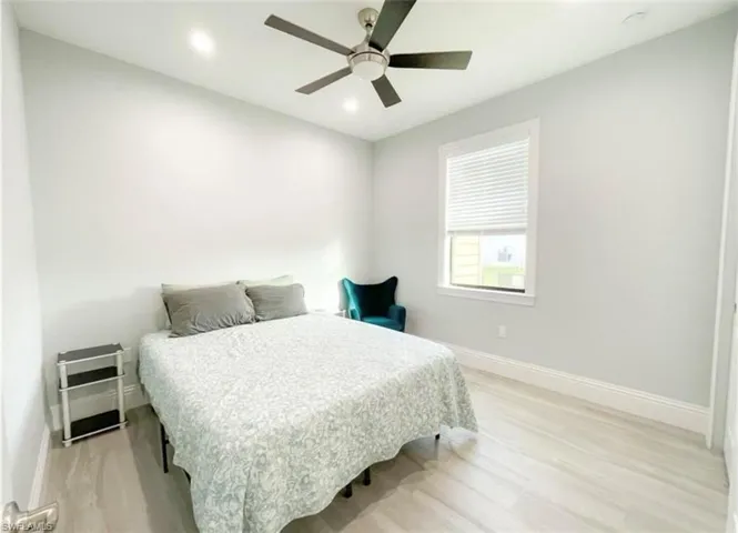 Bedroom with recessed lighting, baseboards, light wood-style flooring, and ceiling fan