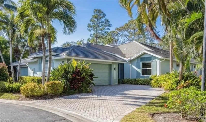Gorgeous single story villa with lush tropical views from every window, 2 car garage and 2 off street parking at the end of the cul-de-sac.