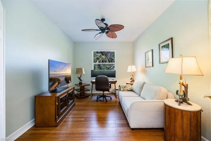 Den with pull out sofa for space to host guests or set up your home office with tropical preserve facing views.