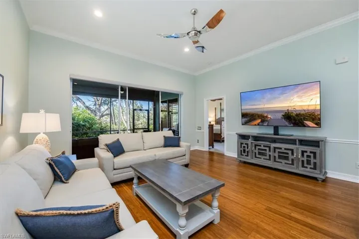 Living roomThe living room connects to the master, den, and lanai, offering ample workspace that enhances the joy of beach living from every perspective. has access to master, den and lanai with an abundace of work space to make life at the beach a delight from every view.