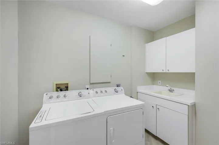 Laundry room with cabinet space and washer and dryer